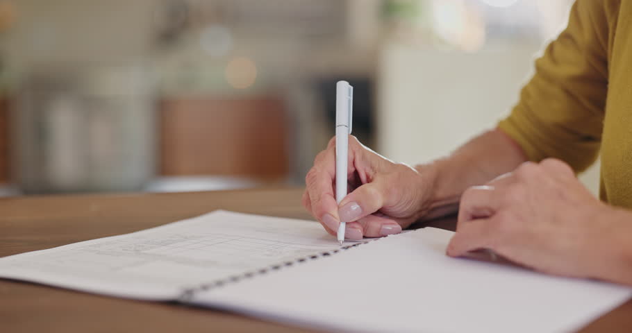 Senior, woman and hands with writing notes to remember, checklist or schedule for alzheimer or memory loss. Elderly person, dementia and closeup of notebook for journal, communication and diary story