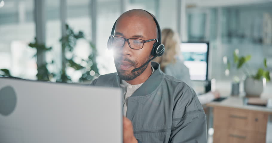 Customer service, office and black man on computer with headset for talking, online help and consulting. Corporate, professional and business person for contact, crm support and virtual assistant