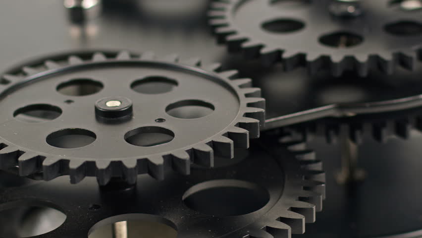 Harmonious Operation of Black Cogs Wheel Gears Footage.