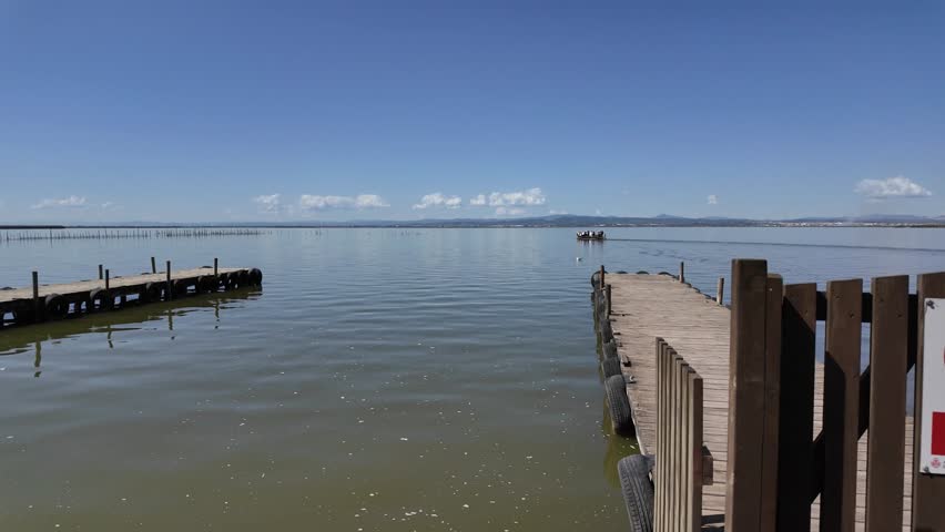 Picturesque view of a boat dock in the Albufera of Valencia, Spain, ready for boat tours and excursions on the lagoon.