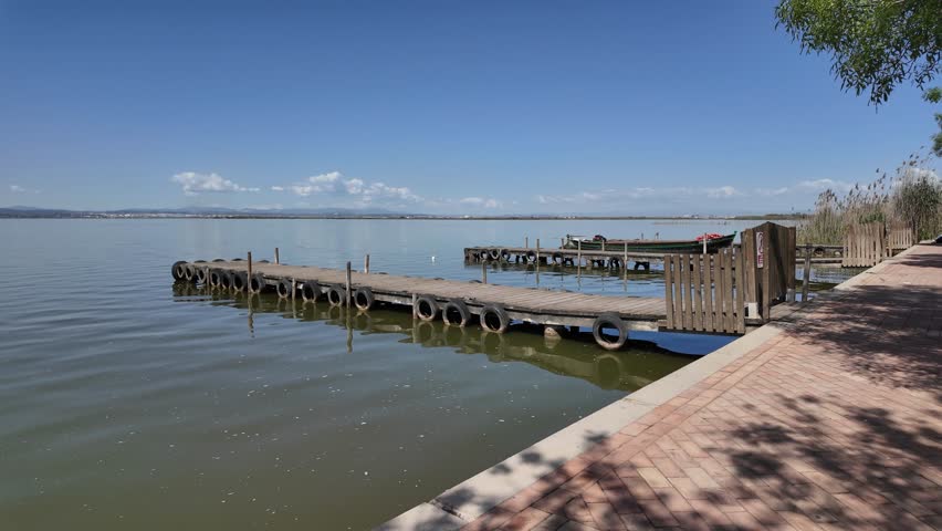 Picturesque view of a boat dock in the Albufera of Valencia, Spain, ready for boat tours and excursions on the lagoon.