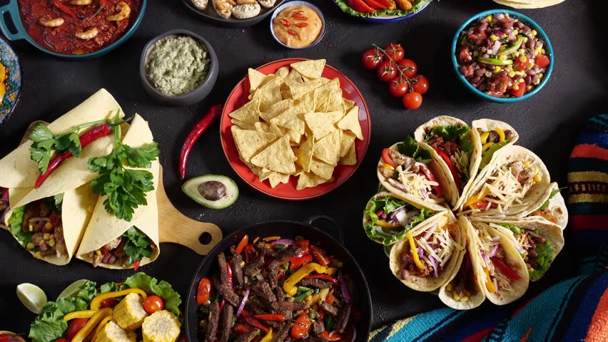 Tex-Mex dishes and ingredients: corn, tortilla chips, cheese, tacos, salsa, chilies, and beef dishes