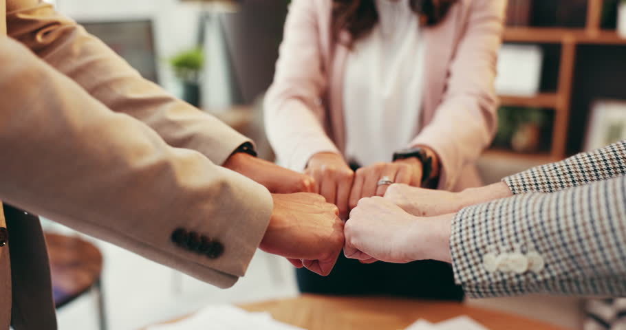 Business, people and hands with fist bump in office for team cooperation, work solidarity or corporate community. Collaboration, group or closeup together for support, meeting or employee integration