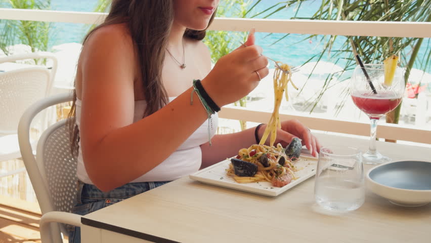 Having A Spaghetti Meal At The Resort In Sardinia, Italy 