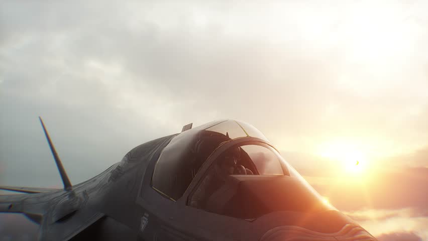 Military fighter jet flying over clouds. Air force.