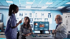 African american nurse measures fever on patient at checkup, offer assistance to the physician at the cabinet. Medical staff uses diagnostic tools and instruments, disease prevention. Camera A. - Powered by Shutterstock - Get 15% off with code: PIKWIZARD15
