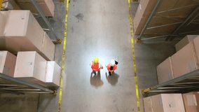 A bird's-eye view of two workers in a warehouse, navigating between aisles filled with boxes, symbolizing efficient logistics and teamwork. - Powered by Shutterstock - Get 15% off with code: PIKWIZARD15