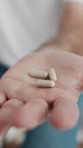 Man Takes and Shows Pills Vitamins or Drugs Tablet in Hand. Close up Hand Holding Variety of White Pills on Palm. Medication Tablets, Capsules From Unrecognizable Patient Hand. Health Care Concept 4k