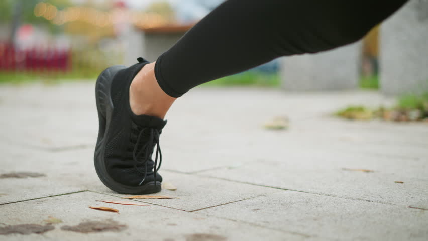 Close-up view of runner leg stretching back and bouncing forward, starting sprint, athletic movement, running action, energy, outdoor exercise, focused stride, fitness motivation, quick start