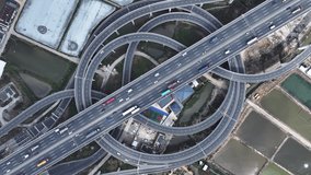 Multi-level overpass China. Lot cars drive on transportation interchange. Road traffic. Chinese economy. Aerial top drone above view of fast urban highway. Modern city freeway. Busy auto express way. - Powered by Shutterstock - Get 15% off with code: PIKWIZARD15