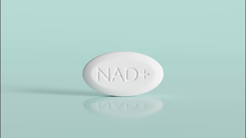 Many NAD supplement white pills fall on glossy blue background. NAD anti-aging therapy concept. 3d animation.