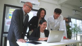 Happy diverse group Asian business team analyzing statistics financial. Group Team of business people meeting conference discussion various topic corporate concept in office. - Powered by Shutterstock - Get 15% off with code: PIKWIZARD15