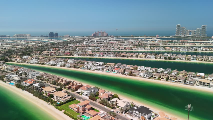 Dubai, UAE: Aerial view of capital city of Emirate of Dubai, artificial islands beach district of Palm Jumeirah - landscape panorama of Arabian Peninsula from above