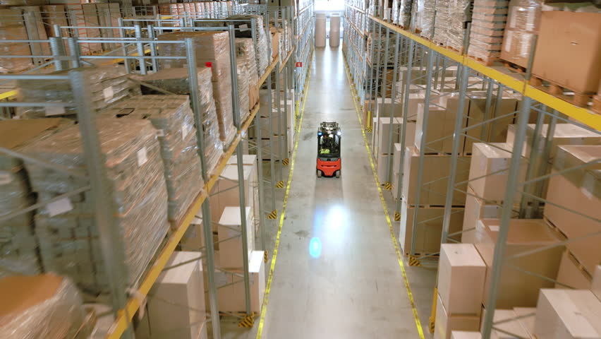 A panoramic warehouse view reveals a forklift navigating the aisles, highlighting efficient storage and logistics management.