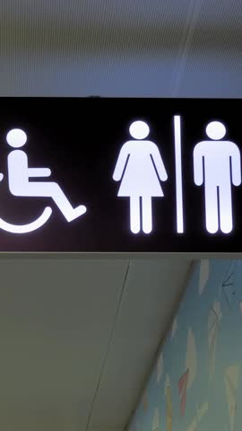 sign. pointer. toilet or WC. Signboard handicap toilet sign, toilet for people with disabilities. Female and male symbols on plates for public toilets, water closets. Pointer wc at the airport.