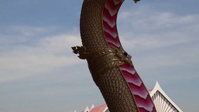 Golden dragon statue with water flowing from its mouth - Powered by Shutterstock - Get 15% off with code: PIKWIZARD15