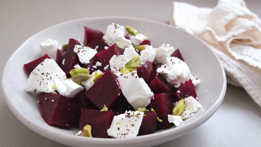 Beetroot salad with feta cheese and pistachios.