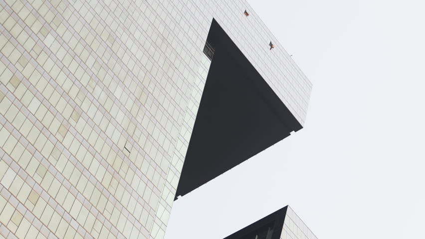 Low shot of tower rooftops.