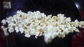 Classic fried popcorn vending machine. Hot popcorn popping energetically out of a popcorn machine.  - Powered by Shutterstock - Get 15% off with code: PIKWIZARD15