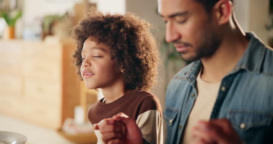 Holding hands, family and praying for food, child and benefits of vitamin c for boy, juice or parents in home. Christian, bonding and belief for breakfast, kid and worship of God, morning and faith