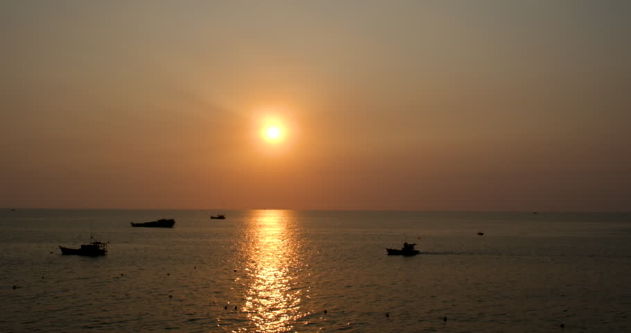 Sea water surface sunset. Low angle view over golden sea water. Sun glare. Abstract nautical summer ocean nature. Holiday, vacation and travel concept. Nobody. Slow motion. Weather and climate change