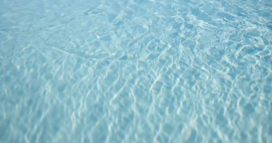 Background, ripples and space with swimming pool outdoor at hotel or resort for relax or wellness. Holiday, summer and vacation with clear water at lodge for accommodation or hospitality from above