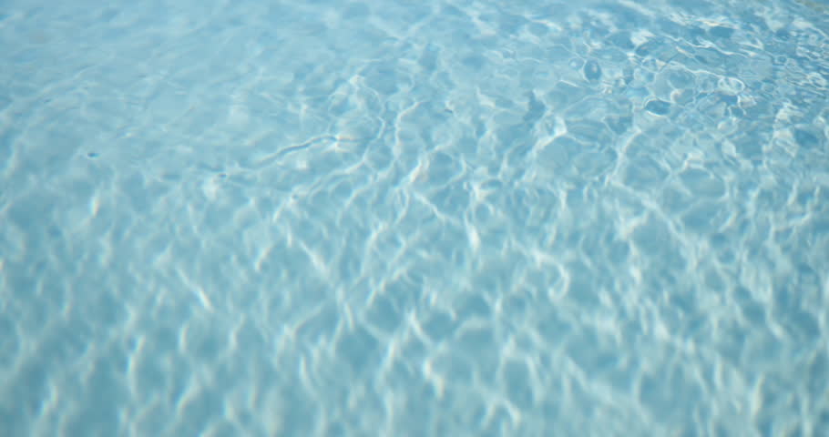 Background, ripples and space with swimming pool outdoor at hotel or resort for relax or wellness. Holiday, summer and vacation with clear water at lodge for accommodation or hospitality from above