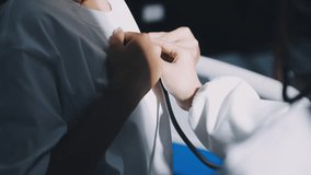 Physical examination of the cardiovascular system with stethoscope of elderly man
 - Powered by Shutterstock - Get 15% off with code: PIKWIZARD15