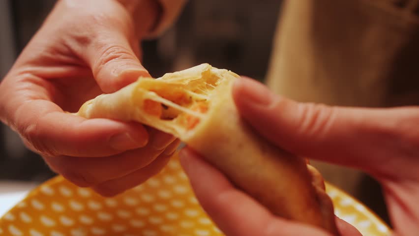 Woman eating empanadas argetinian pie, Samosa tart, traditional bakery from argentina, chef filling dough in home with meat and vegetables, homemade spanish empanadas