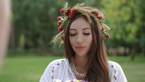 A serene woman wearing a beautiful floral crown, gently holding a vibrant bouquet in a picturesque natural setting - Powered by Shutterstock - Get 15% off with code: PIKWIZARD15