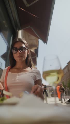 Dining Experience with Wine and Smartphone at a Chic Caf