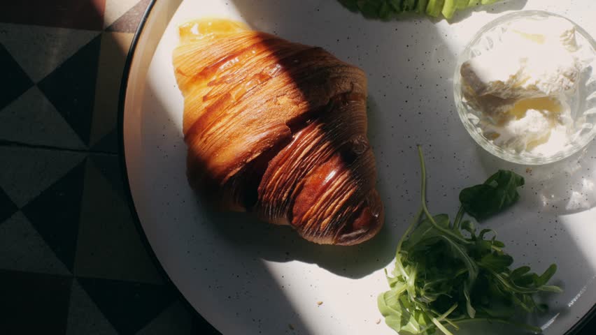 Bagel sandwich brunch, lunch plate of a bagel with smoked salmon and cream cheese and ham, close up morning cafe menu.