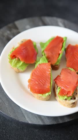 Sandwich salmon red fish seafood appetizer dish fresh tasty gourmet food background on table rustic food top view copy space pescetarian diet
