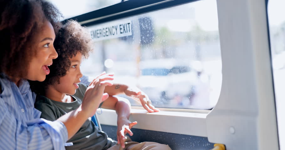 Woman, wave and child travel on bus with window, city commute and sightseeing adventure. Bonding, mother and curious son on public transport for family trip, discussion or journey on weekend break