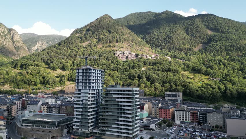 Drone view of in Andorra la Vella capital surrounded by Pyrenees mountains during the day
