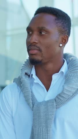 A Confident Man Dressed in Casual Attire, sporting a Stylish Sweater, looks very appealing