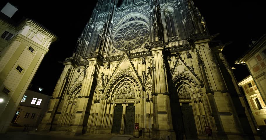 Prague St. Vitus Cathedral gothic church building detailed view at night illuminated in the dark, no people, nobody around in the old town castle area