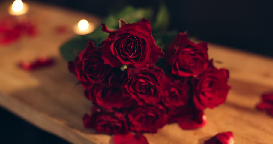 Roses, table and romantic for anniversary, restaurant and gift for date on valentines day and closeup. Commitment, bouquet and flowers for celebration of love, petal or floral arrangement for present