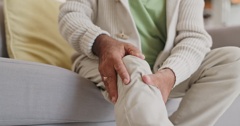 Hands, knee pain and elderly person with injury, muscle tension or pressure with inflammation from arthritis. Rheumatoid, fibromyalgia and massage joint for relief, health issue and osteoporosis