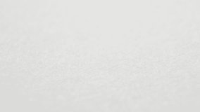 Close up of an antique calligraphy pen nib writing a thick black line. Slow motion of a classic vintage fountain pen drawing a curvy line with ink absorbed by the parchment paper. - Powered by Shutterstock - Get 15% off with code: PIKWIZARD15