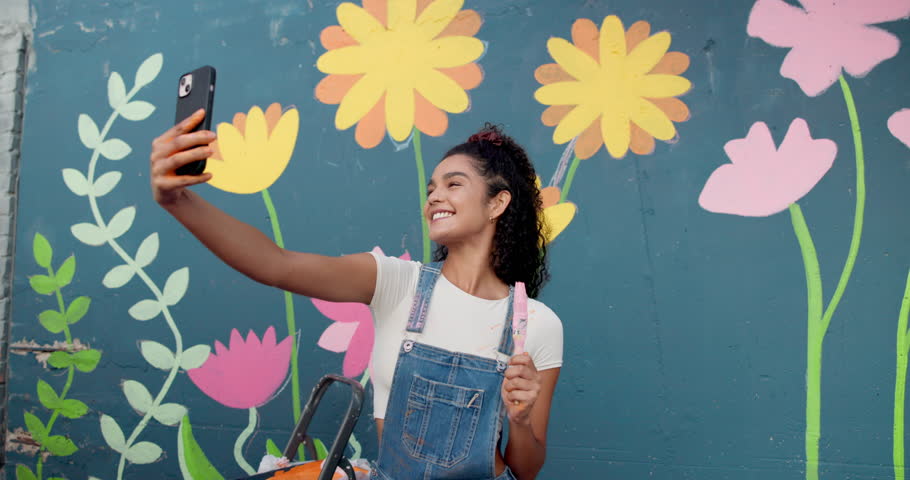 Artist, selfie and woman with smile, confident and photography of wall art for memory or flower decor. Mural, painter and person with picture for social media, influencer or proud of finished artwork