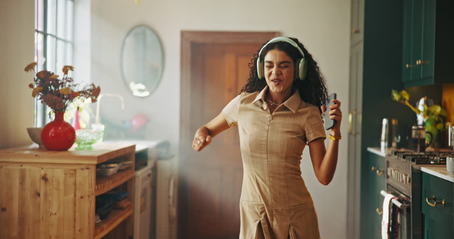 Dance, headphones and student with woman in home with laptop for streaming, college success and happy. Excited, university scholarship and energy with person in apartment for music, online and sound