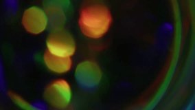 Blur rays. Glitter light. Defocused leak multicolor green yellow rainbow flickers beam lens flare on abstract art dark black bokeh background. - Powered by Shutterstock - Get 15% off with code: PIKWIZARD15