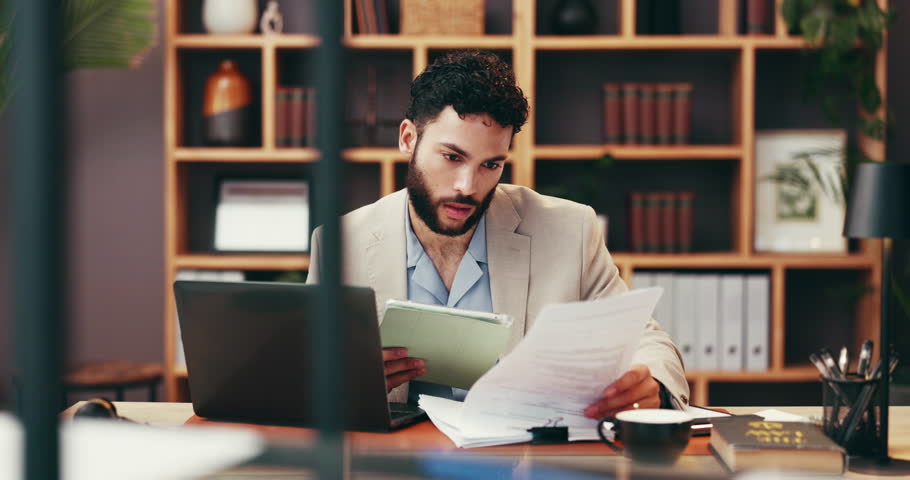Businessman, reading and lawyer with documents or tablet for legal advice, information or testimonial. Man, employee or attorney with paperwork or technology on laptop for law, policy or legislations