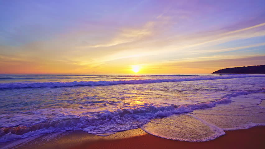 Dramatic sea sunrise or sunset sky over sea. Burning sky and shining golden waves landscape,Beautiful waves crashing on sandy shore	