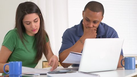 African american and caucasian couple in debt