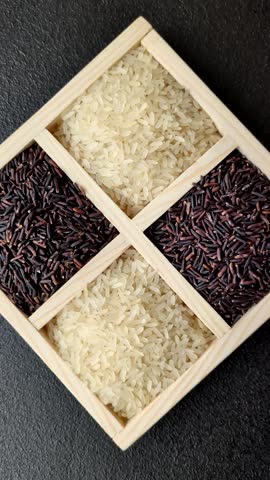 White and red raw rice grains in a ceramic bowl. Rice as an ingredient in Asian organic food