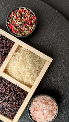 White and red raw rice grains in a ceramic bowl. Rice as an ingredient in Asian organic food