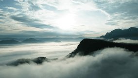 Aerial shot of Serene mountain landscape with rolling clouds, mist, and a dramatic pastel sky. - Powered by Shutterstock - Get 15% off with code: PIKWIZARD15