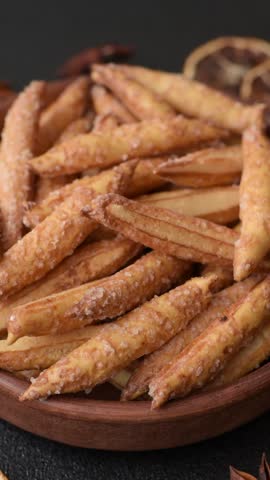 Cinnamon flavored biscuits or breadsticks as a food background.